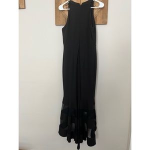 Long Black Dress by Xscape. Size 10. Flowy bottom with sheer black pieces.